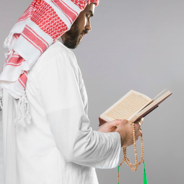 muslim-man-reading-from-quran-holding-praying-beads