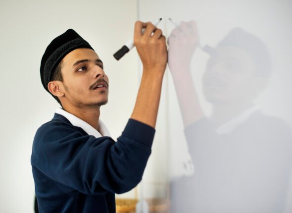 young-muslim-man-is-writing-white-board
